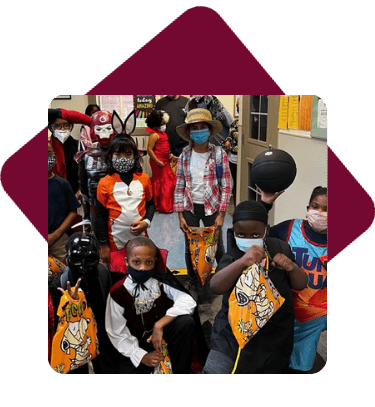 Students at halloween party in costumes