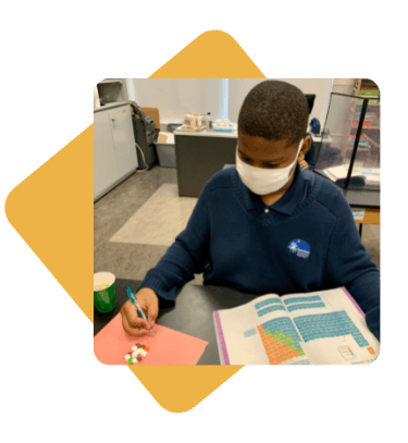 Student working on science work
